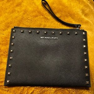 Black studded Micheal Kors clutch/large wristlet.